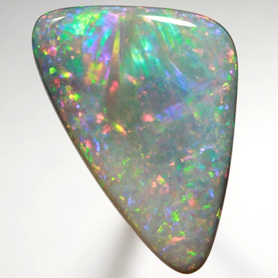 SOLID SEMI BLACK OPAL Very unual opal with an exploding rainbow. SEE VIDEO  